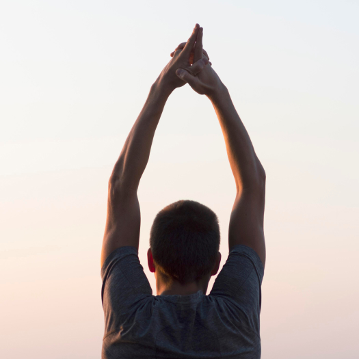 Man practicing yoga as a symbol of health and wellness promoted by IntegraMed’s Anti-Aging clinic.