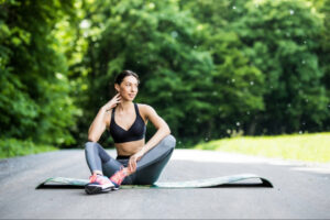 Woman recovering outdoors after exercise, representing sustainable lifestyle practices, long-term wellness planning, and the importance of ongoing physical activity in safe, monitored metabolic health management.