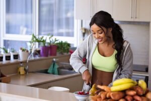 Woman preparing healthy meals as part of long-term lifestyle changes during weight loss therapy